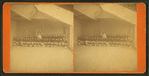 Studio view of 50 children in Revolutionary era outfits.