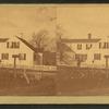 Unidentified home at a cross roads surrounded by a picket fence.