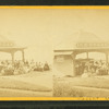 Group of people in front of the ice cream stand.