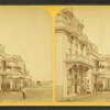View of people in front of cottages.