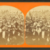 Large group of people gathered on the deck of a boat(?).