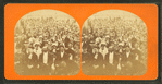 Large group of people gathered on the deck of a boat(?).