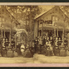 Large group portrait in front of a cottage.