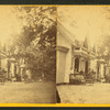 People in front of cottages.