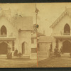 People in front of a cottage.