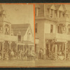 Gathering in front of a commercial building.
