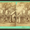 People in front of a cottage.