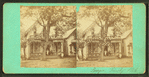 People in front of a cottage.