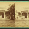 Two people sitting in front of an office.