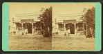 Two people sitting in front of an office.