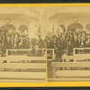 Large group at speaker's stand.