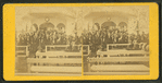 Large group at speaker's stand.