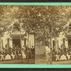 Group gathered in front of a cottage.