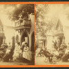 People gathered in front of a cottage.