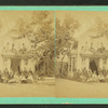 Group gathered in front of a cottage.