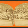 Large group portrait, wagon in background.