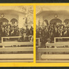 Large group at speaker's stand.
