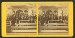 Large group at speaker's stand.
