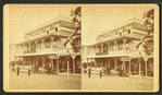 Wesley House, with sign for ice cream, store with merchandise next door.