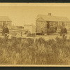 View of the Hermit (Fred Parker?) in front of his house.]