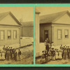 Group of children in front of a building.