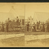 People in and gathered around a wagon.