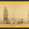 View of the wreck of the "Minmanuett," showing spectators sitting on bags of coffee (its cargo) on the shore.