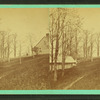View of part of a house on a hill.