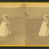 Toddler with croquet mallet and stake.