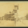 View of a commercial street after a snow storm.