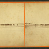 Group of people on the beach in the distance.