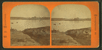 View of a lake, buildings on opposite shore.