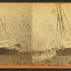 Winter scene showing a ship with ice covering the rigging.