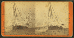 Winter scene showing a ship with ice covering the rigging.