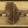 View of a stone arch bridge.