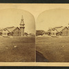 View of an unidentified half-timbered building with a tower.