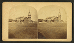 View of an unidentified half-timbered building with a tower.