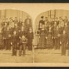 A group of student on the steps of their school.