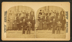 A group of student on the steps of their school.
