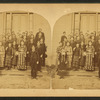 A group of student on the steps of their school.