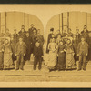 A group of student on the steps of their school.