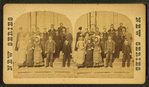 A group of student on the steps of their school.