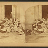 A group of students on the steps of their school.