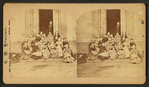 A group of students on the steps of their school.