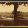 Farm land and fences in foreground.