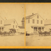Street view showing men and delivery wagon.