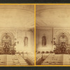 Interior of Universalist church with altar decorated with garlands.