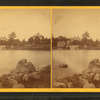 View of buildings across a lake.