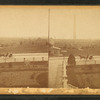 View of the Bunker Hill Monument, road with horse and buggy in the foreground.