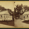 View of E. Camfill & Sons Monumental Works, with workers in front.